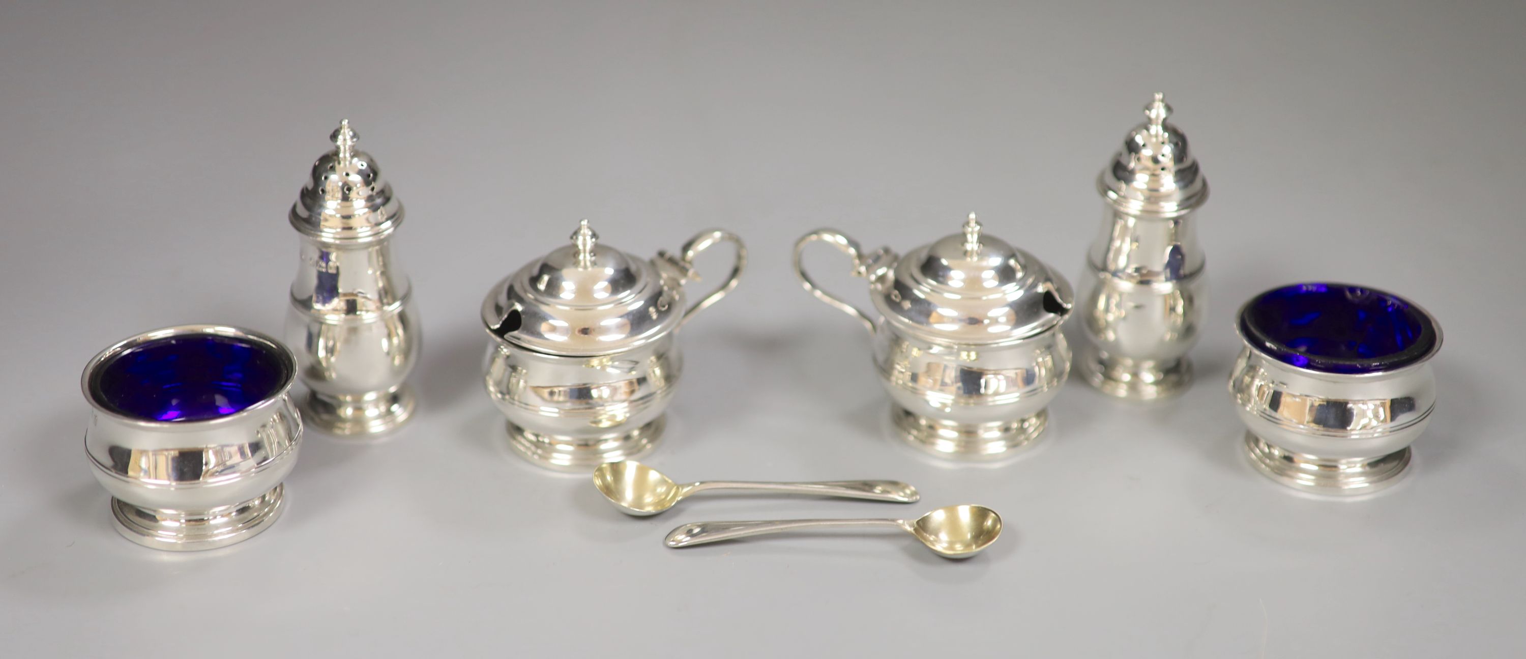 A George V silver six piece condiment set, Adie Brothers, Birmingham, 1927/29/30, pepper 78mm